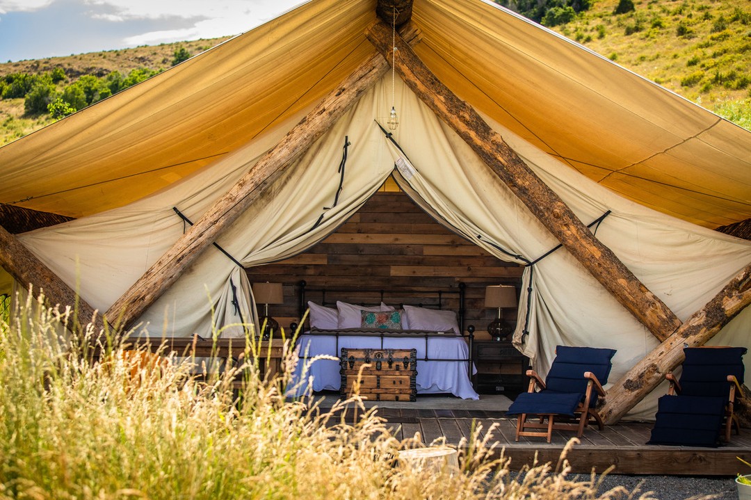 Stripped down conestoga-themed glamping tent