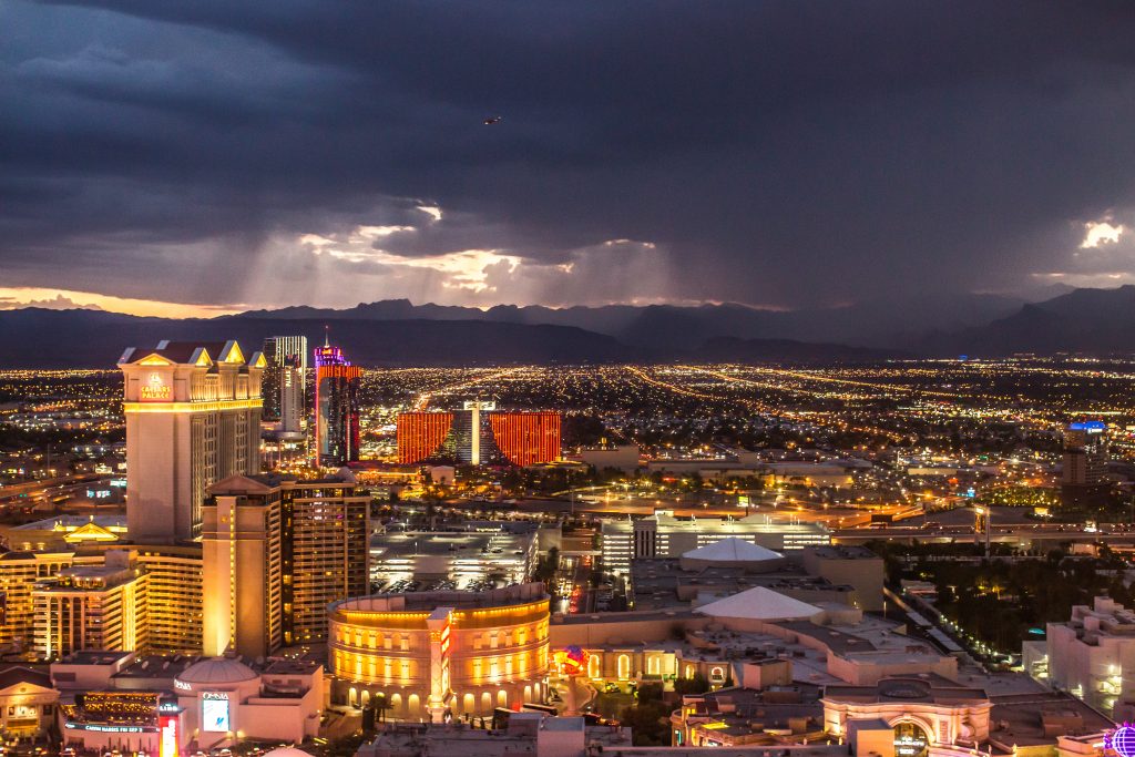 Aerial shot of buildings and structures in Las Vegas, Nevada during twilight.